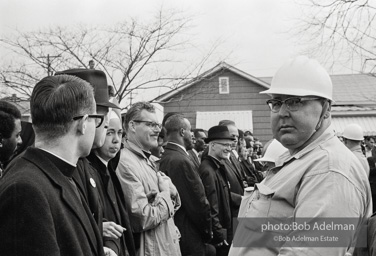 Stand-off: Sheriff Jim Clark's posse form a barrier, facing off with protestors who chant Stand-off: Sheriff Jim Clark's posse form a barrier, facing off with protestors who chant