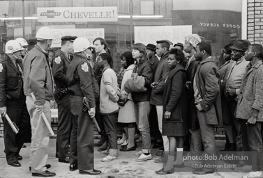 Police blocking demonstrators from approaching the courthouse in downtown, Selma, 1965. Police blocking demonstrators from approaching the courthouse in downtown, Selma, 1965.