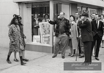 Words can wound, and the hecklers know it as they insult two black women who are part of a voting rights drive, Selma, Alabama. 1965.