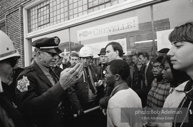 Police blocking demonstrators from approaching the courthouse in downtown, Selma, 1965.