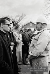 Stand-off: Sheriff Jim Clark's posse form a barrier, facing off with protestors who chant Stand-off: Sheriff Jim Clark's posse form a barrier, facing off with protestors who chant