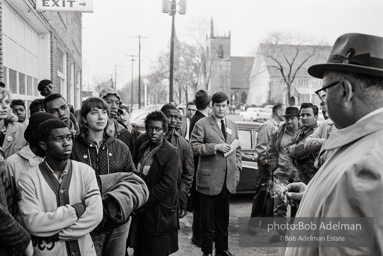 Police blocking demonstrators from approaching the courthouse in downtown, Selma, 1965.