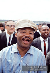 “King broke into a grin as he entered the city limits of Montgomery. Some of the obstacles he had overcome had to be on his mind.” Montgomery, Alabama. 1965