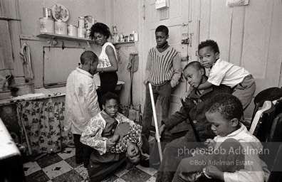 Eartha Holman, a single mother on welfare, lived with her eight children in a three-room, fifth-floor walk-up, Harlem, New York City.  1966