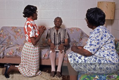 Love thy neighbor: A visiting prayer band prays with a blind parishioner,  Mantua,  Alabama  1983