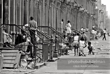 The Bedford Stuyvesant ghetto,  Brooklyn,  New York City.  1963

As difficult as the Bed Stuy street might look, it was
teeming with life. Twenty years later, I went back and
the neighborhood had fallen apart. All the buildings were
boarded up and deserted.