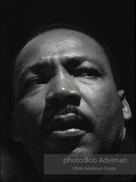 Martin Luther King in a quiet moment as he prepares to speak  in Montgomery,  Alabama.  1965