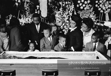 Members of King’s family, including his wife and children, view his body as it lies in state,  Atlanta, Georgia.  1968-


“The King family had had to share him with the world all his life, and now he was finally home. He once voiced how he wished to be remembered and those words resonated at his funeral. ‘I’d like someone to mention that I tried to be right on the war question … that I did try to feed the hungry … that I did try, in my life, to clothe those who were naked … that I did try, in
my life, to visit those who were in prison … that I tried to love and serve humanity.’”