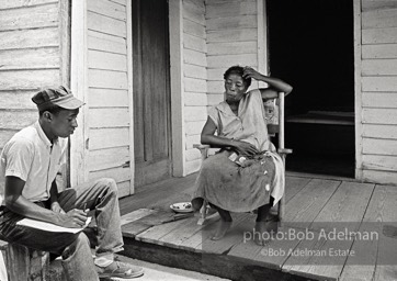 CORE worker Danny Williams canvassing at a woman’s house, West Feliciana Parish, LA 1964