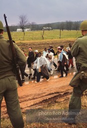 “With helicopters whirring above and the 54 miles of highway closely guarded by U.S. Army troops and the Alabama National Guard, the march into the Cradle of the Confederacy, Montgomery, was the greatest display of the power of the people’s right to peacefully petition since Gandhi’s Salt March to the sea. King’s ultimate faith in American justice was rewarded by the military’s
protection, by President Johnson’s vow that ‘we shall overcome’ and by Johnson’s call for passage of a voting rights bill.”  1965