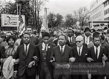 Dr. King leads a protest march around the state capital in Montgomery Alabama protesting the treatment of black demonstrators and voter applicants in Selma, Alabama prior to the Selma to Montgomery march. Montgomery, Alabama. 1965.