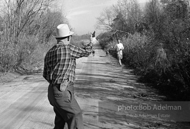 I. Byrd Parnell. Sheriff of Sumter, S.C. training the dogs to follow an escaped prisoner.