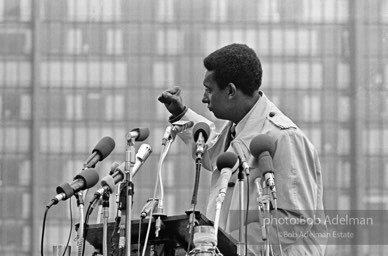 King led anti-Vietnam war protest. NYC, 1967. Black power: Activist Stokely Carmichael salutes a peace rally with the Black Power gesture at the United Nations, New York City. 1967.