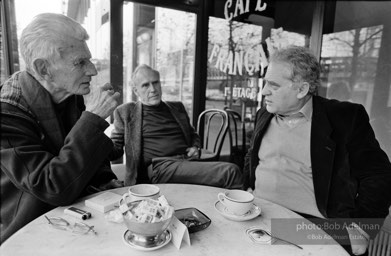 Samuel Beckett has coffee with his publisher, Barney Rossett and the director of the Samuel Beckett Theater at a cafe in Paris, 1986