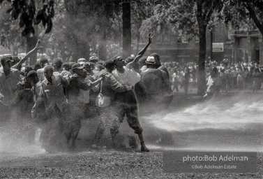 Unified resistance, Kelly Ingram Park, Birmingham 1963
Demonstrators quickly learned that by huddling together they could use their combined strength to withstand the blast of the fire hoses. Unified resistance, Kelly Ingram Park, Birmingham 1963
Demonstrators quickly learned that by huddling together they could use their combined strength to withstand the blast of the fire hoses.