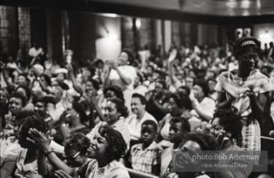 The audience responds as Martin Luther King and Ralph Abernathy speak at the 16th Stret Baptist Church. Birmingham Alabama, 1963.