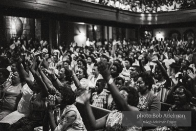 The audience responds as Martin Luther King and Ralph Abernathy speak at the 16th Stret Baptist Church. Birmingham Alabama, 1963.