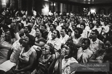 The audience responds as Martin Luther King and Ralph Abernathy speak at the 16th Stret Baptist Church. Birmingham Alabama, 1963.