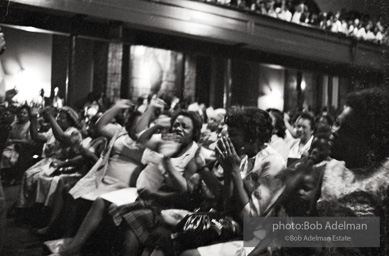 The audience responds as Martin Luther King and Ralph Abernathy speak at the 16th Stret Baptist Church. Birmingham Alabama, 1963.