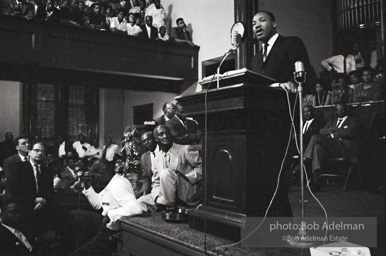 During a mass meeting at the 16th Street Baptist Church, King urges his supporters to join the demonstrations,  Birmingham,  Alabama.  1963