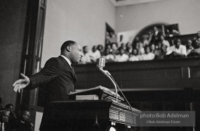 During a mass meeting at the 16th Street Baptist Church, King urges his supporters to join the demonstrations,  Birmingham,  Alabama.  1963