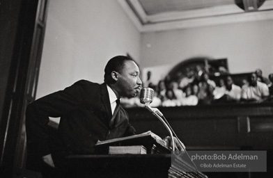 During a mass meeting at the 16th Street Baptist Church, King urges his supporters to join the demonstrations,  Birmingham,  Alabama.  1963