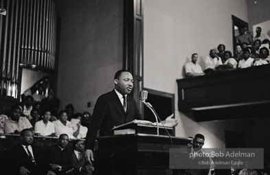 During a mass meeting at the 16th Street Baptist Church, King urges his supporters to join the demonstrations,  Birmingham,  Alabama.  1963