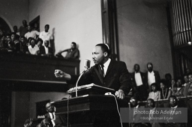 During a mass meeting at the 16th Street Baptist Church, King urges his supporters to join the demonstrations,  Birmingham,  Alabama.  1963