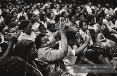 The audience responds as Martin Luther King and Ralph Abernathy speak at the 16th Stret Baptist Church. Birmingham Alabama, 1963.