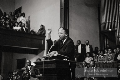 During a mass meeting at the 16th Street Baptist Church, King urges his supporters to join the demonstrations,  Birmingham,  Alabama.  1963