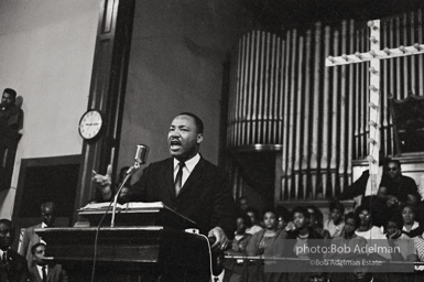 During a mass meeting at the 16th Street Baptist Church, King urges his supporters to join the demonstrations,  Birmingham,  Alabama.  1963