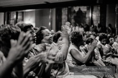 The audience responds as Martin Luther King and Ralph Abernathy speak at the 16th Stret Baptist Church. Birmingham Alabama, 1963.