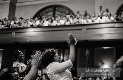 The audience responds as Martin Luther King and Ralph Abernathy speak at the 16th Stret Baptist Church. Birmingham Alabama, 1963.