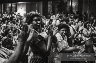 The audience responds as Martin Luther King and Ralph Abernathy speak at the 16th Stret Baptist Church. Birmingham Alabama, 1963.