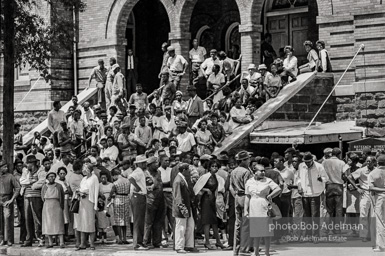 Onlookers on the steps of the 16th Street Baptist Church. Many of these people were the parents of the young people participating in the Children’s March. Birmingham, AL, 1963.