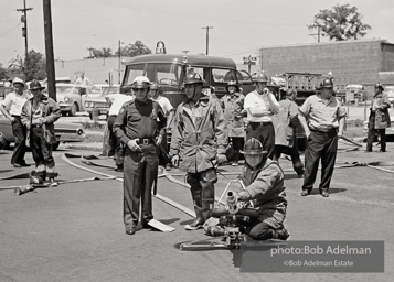 Setting up the high-powered water cannons which were turned on the protestors in Kelly Ingram Park. Birmingham, AL, 1963.