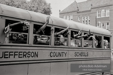 A bus full of youthful protestors heading for a detention center. Birmingham, AL, 1963.