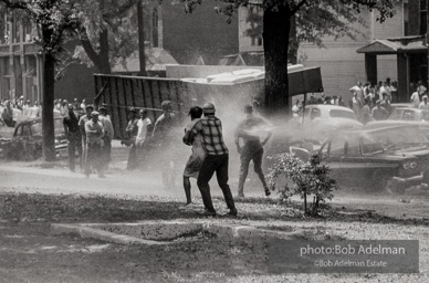 Demonstrators hold onto each other to face the spray, Kelly Ingram Park, Birmingham 1963.