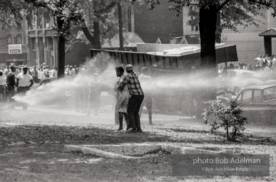 Demonstrators hold onto each other to face the spray, Kelly Ingram Park, Birmingham 1963.