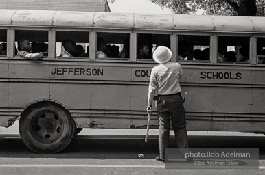 A bus full of youthful protestors heading for a detention center. Birmingham, AL, 1963.