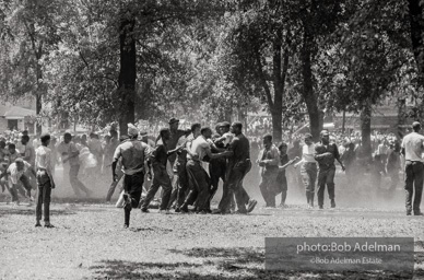 Demonstrators hold onto each other to face the spray, Kelly Ingram Park, Birmingham 1963