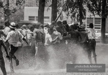 Demonstrators hold onto each other to face the spray, Kelly Ingram Park, Birmingham 1963 Demonstrators hold onto each other to face the spray, Kelly Ingram Park, Birmingham 1963