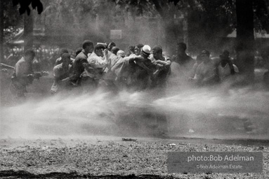 Demonstrators hold onto each other to face the spray, Kelly Ingram Park, Birmingham 1963