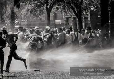 Unified resistance, Kelly Ingram Park, Birmingham 1963
Demonstrators quickly learned that by huddling together they could use their combined strength to withstand the blast of the fire hoses. Unified resistance, Kelly Ingram Park, Birmingham 1963
Demonstrators quickly learned that by huddling together they could use their combined strength to withstand the blast of the fire hoses.