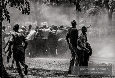 Unified resistance, Kelly Ingram Park, Birmingham 1963
Demonstrators quickly learned that by huddling together they could use their combined strength to withstand the blast of the fire hoses. Unified resistance, Kelly Ingram Park, Birmingham 1963
Demonstrators quickly learned that by huddling together they could use their combined strength to withstand the blast of the fire hoses.