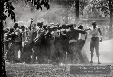 Unified resistance, Kelly Ingram Park, Birmingham 1963
Demonstrators quickly learned that by huddling together they could use their combined strength to withstand the blast of the fire hoses. Unified resistance, Kelly Ingram Park, Birmingham 1963
Demonstrators quickly learned that by huddling together they could use their combined strength to withstand the blast of the fire hoses.