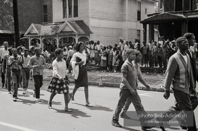 Young protestors, after meeting at the 16th Street Baptist Church, begin their Children's Crusade and are soon arrested and bussed to a detention center. Birmingham, AL, 1963.