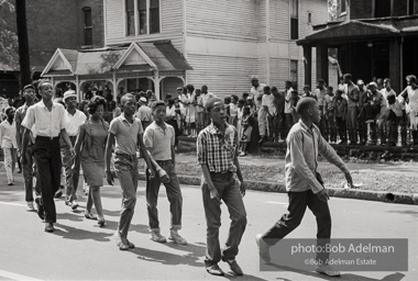 Young protestors, after meeting at the 16th Street Baptist Church, begin their Children's Crusade and are soon arrested and bussed to a detention center. Birmingham, AL, 1963.