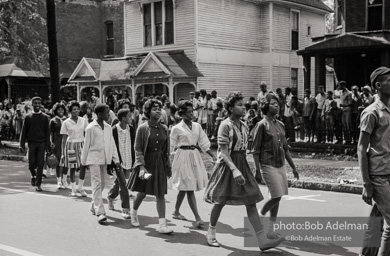 Young protestors, after meeting at the 16th Street Baptist Church, begin their Children's Crusade and are soon arrested and bussed to a detention center. Birmingham, AL, 1963.