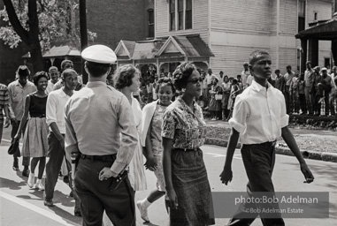 Young protestors, after meeting at the 16th Street Baptist Church, begin their Children's Crusade and are soon arrested and bussed to a detention center. Birmingham, AL, 1963. Young protestors, after meeting at the 16th Street Baptist Church, begin their Children's Crusade and are soon arrested and bussed to a detention center. Birmingham, AL, 1963.